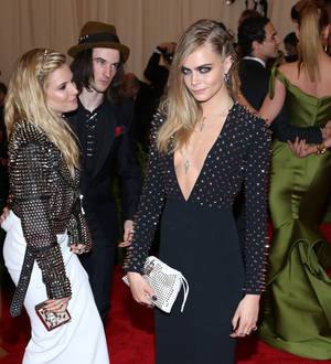 Sienna Miller and Cara Delevingne smooch at Met Ball