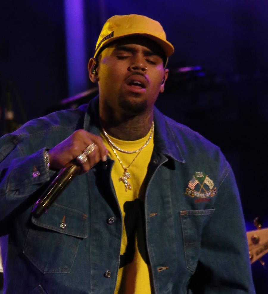 Chris Brown stays seated during national anthem