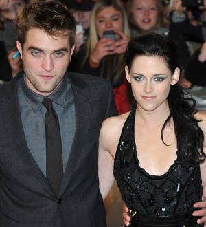 Taylor Lautner dodges questions about co-star Kristen Stewart's kissing scandal