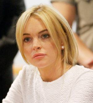 Lindsay Lohan & Danny DeVito celebrate Mubarak's resignation on Twitter