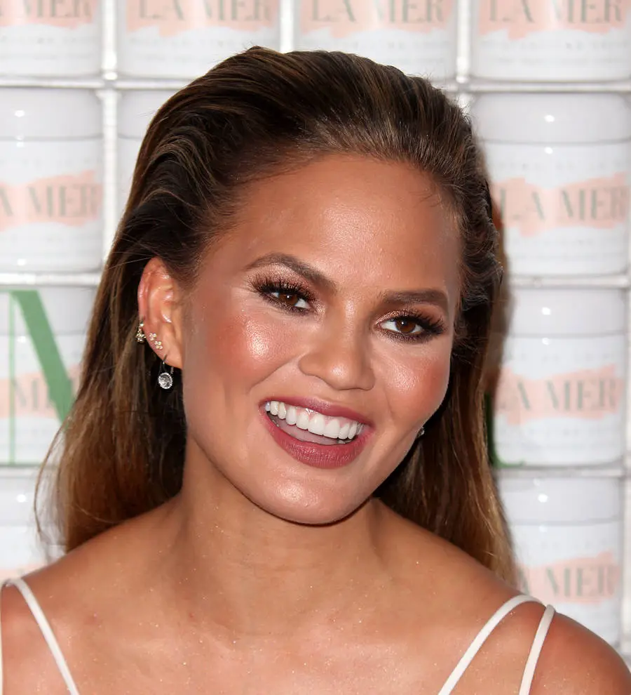 Chrissy Teigen's tailors fix baby bump wardrobe malfunction