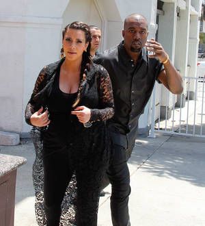 Kanye West hits head on street sign