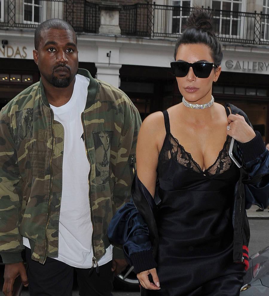 Kanye West takes family to visit mother's grave
