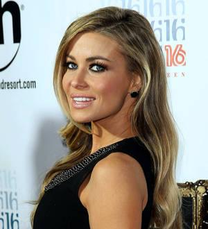 Carmen Electra kisses Olympic swimmer Ryan Lochte