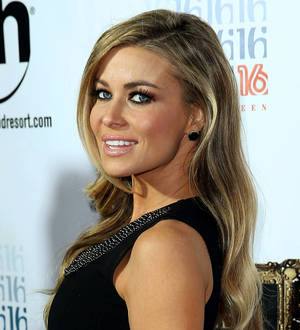 Carmen Electra kisses Olympic swimmer Ryan Lochte