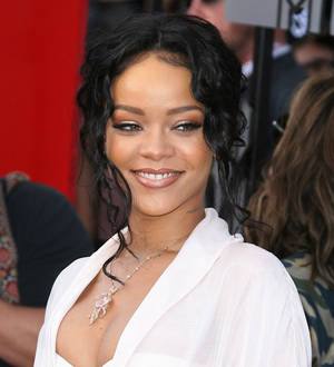 Rihanna goes topless for raunchy magazine cover
