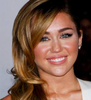 Miley Cyrus cracks back bone