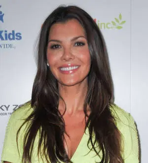 Ali Landry bares her baby belly for cocoa butter firm again