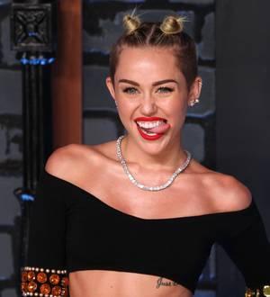 Miley Cyrus and Kim Kardashian are worst dressed stars of 2013