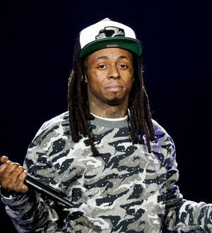 Lil Wayne sues record label boss