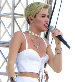 Miley Cyrus strips off again for another raunchy performance
