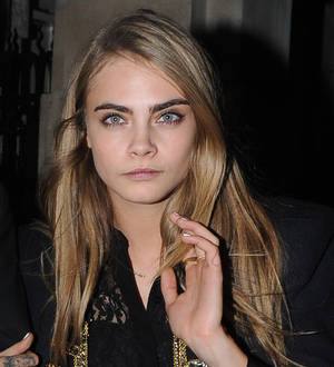 Cara Delevingne creates purse line