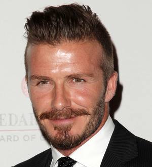 David Beckham's Olympic torch to be sold at auction