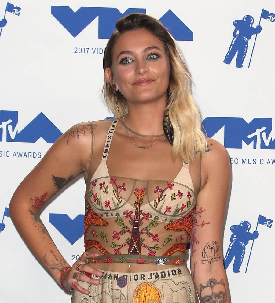 Paris Jackson poses topless to show off new tattoo