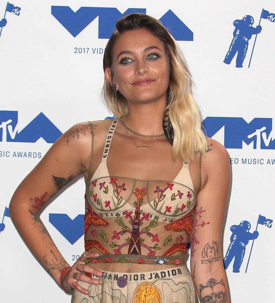 Paris Jackson poses topless to show off new tattoo