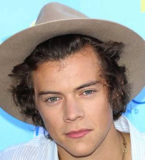 Harry Styles and James Corden kiss on TV