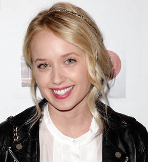 Megan Park with a thoughtful expression, her hands casually resting near her chin
