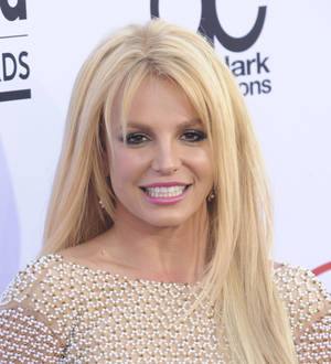 Britney Spears paints topless to Mariah Carey's music