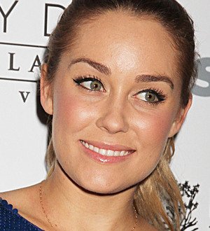 Lauren Conrad poses topless for magazine