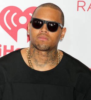 Chris Brown and Tyga pay tribute to couple dead in murder-suicide