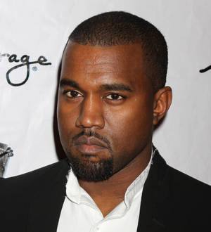 Kanye West grapples with paparazzo in airport bust-up