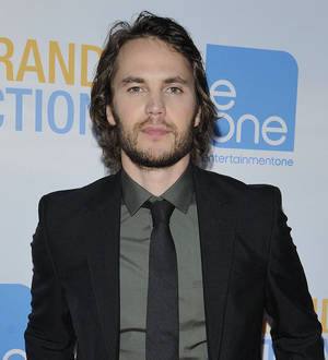 Taylor Kitsch in talks to star in The Raid remake