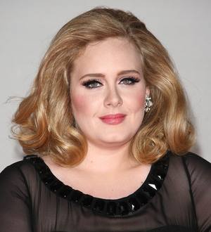 Adele steps out with new baby