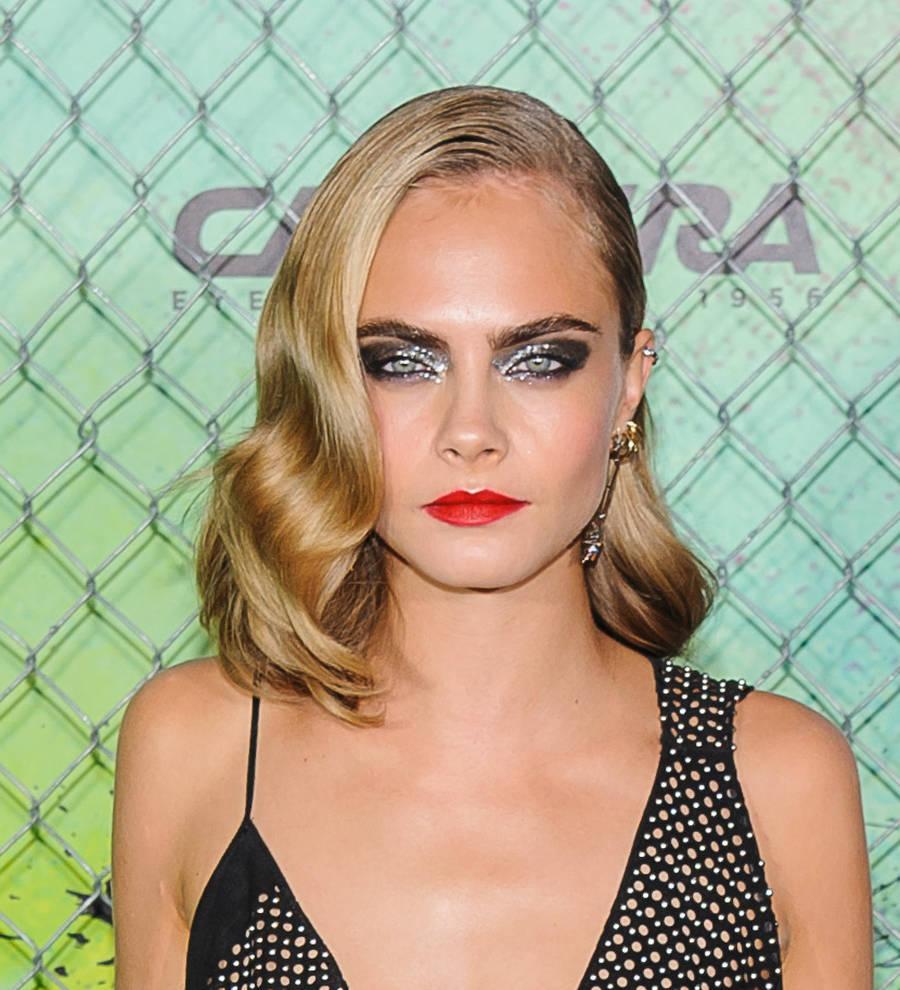 Cara Delevingne raised to keep 'weak' emotions under wraps