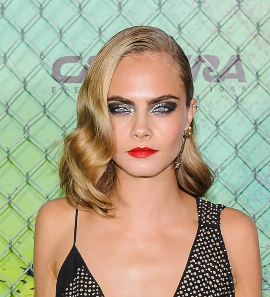 Cara Delevingne raised to keep 'weak' emotions under wraps