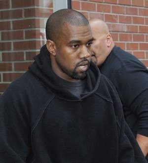 Kanye West makes surprise appearance at high school open mic night