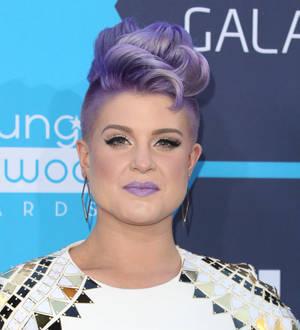 Kelly Osbourne teases fans with book project
