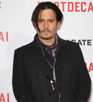 Johnny Depp injures hand in Australia
