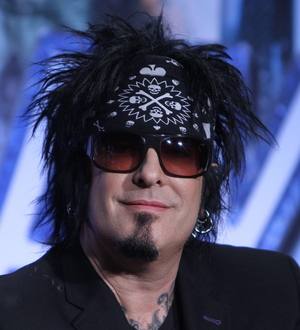Motley Crue and Kiss brave floods to play for fans