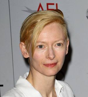 Swinton cuts promo duties to clean kids' school