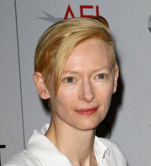Swinton cuts promo duties to clean kids' school