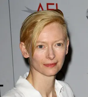 Swinton cuts promo duties to clean kids' school