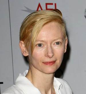 Swinton cuts promo duties to clean kids' school