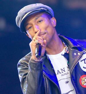 Pharrell Williams makes children Happy with Glastonbury party