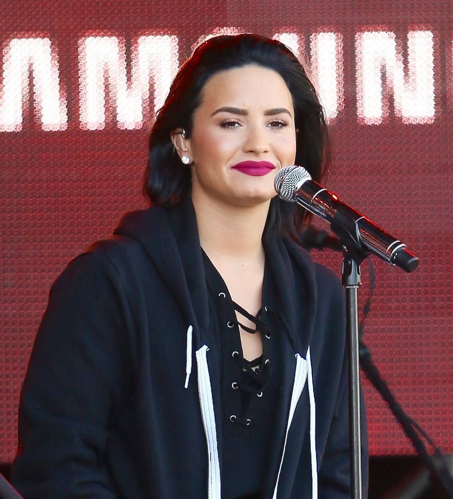 Heartbroken Demi Lovato all smiles at fight night