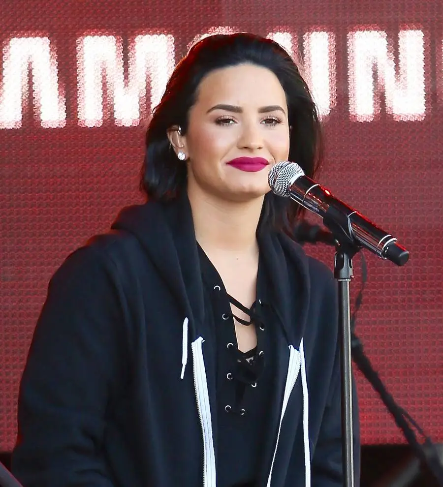 Heartbroken Demi Lovato all smiles at fight night