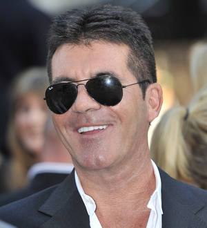 Simon Cowell kisses Lauren Silverman on holiday