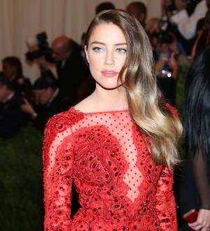 Amber Heard frolics with another woman in sexy art piece