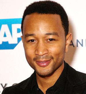 John Legend delays tour to complete album