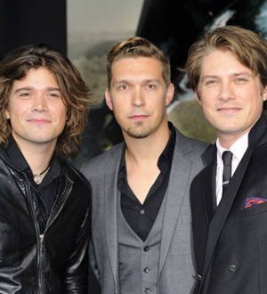 Hanson press on with Australian shows after star falls ill
