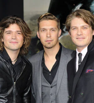Hanson press on with Australian shows after star falls ill
