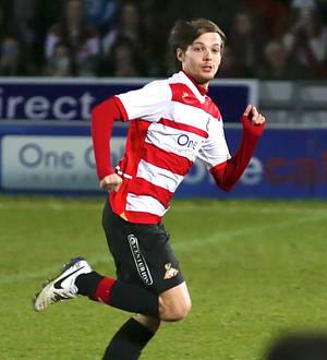 Louis Tomlinson's pro-soccer debut draws massive crowds