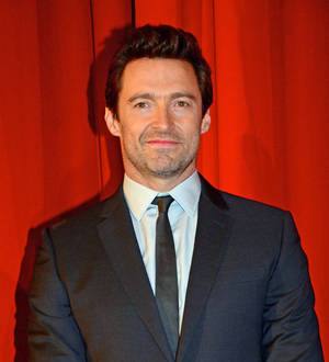 Hugh Jackman gifted with toy from paparazzo