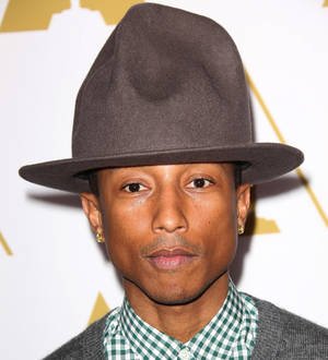 Pharrell Williams performs star-studded set at basketball game