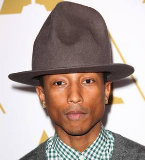 Pharrell Williams performs star-studded set at basketball game