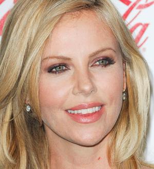 Charlize Theron ripped stomach muscle on Snow White set